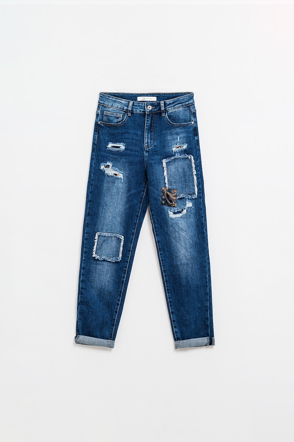 Loose blue jeans with subtle ripped design and patches