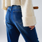 Loose blue jeans with subtle ripped design and patches