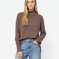 Loose brown sweater with open back detail
