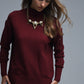 Loose burgundy sweater with open back detail