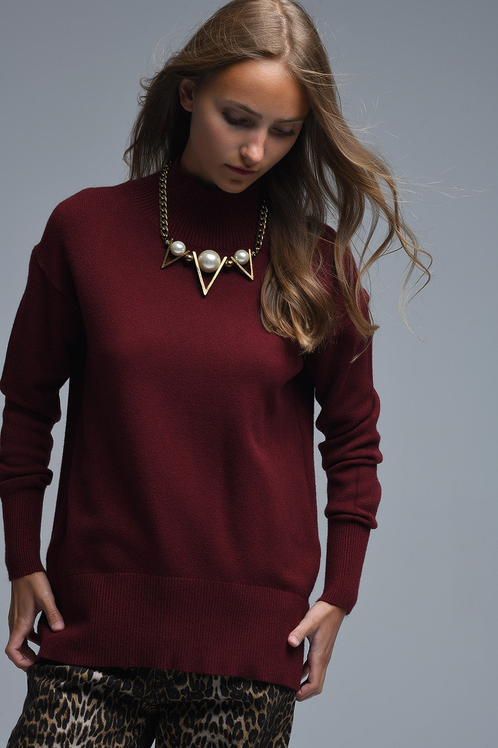 Loose burgundy sweater with open back detail