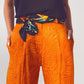 Pantalones holgados con estampado de cebra en naranja