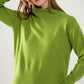 Loose green sweater with opening in the back