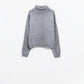 Loose grey sweater with dropped sleeves