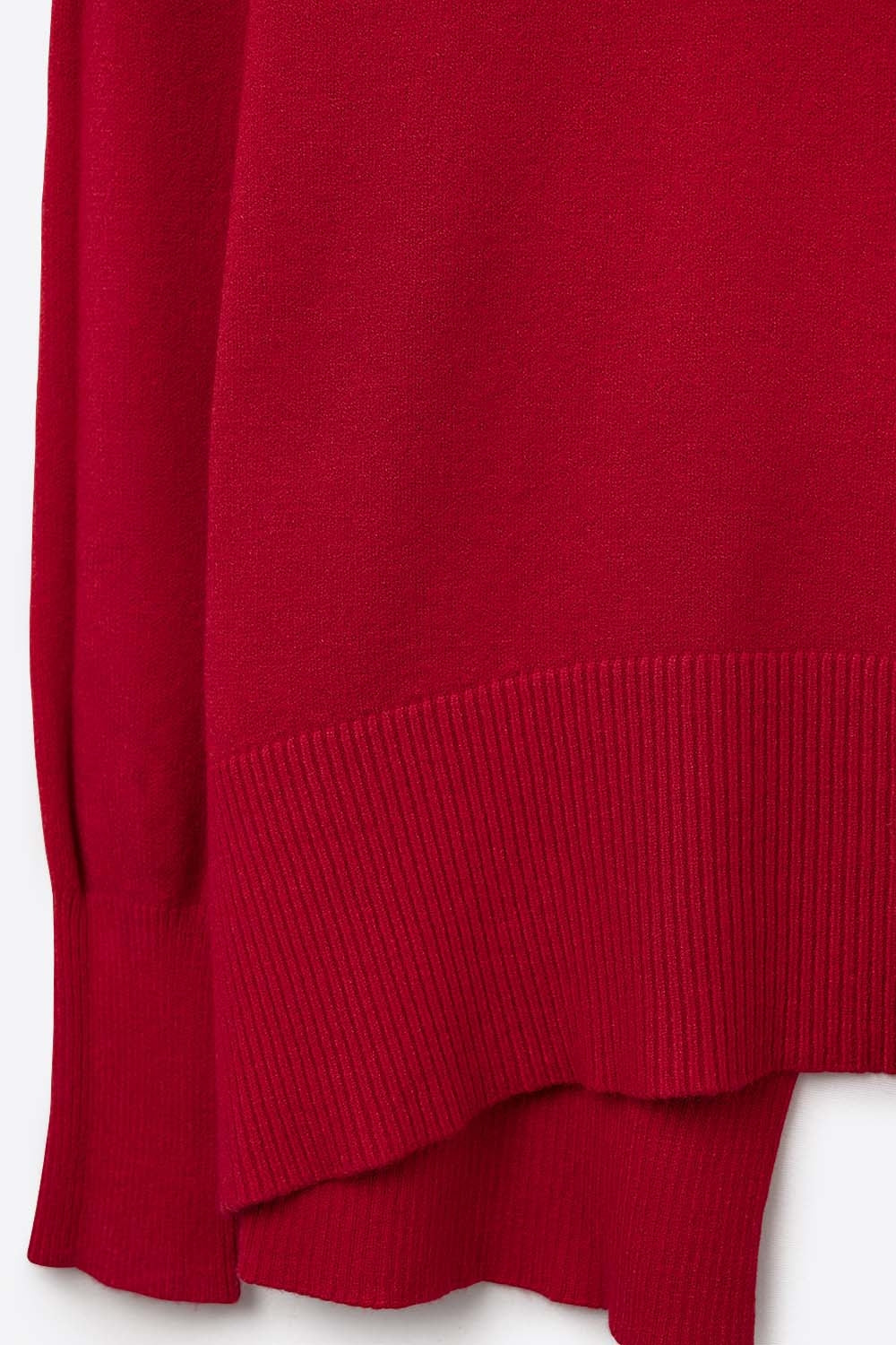 Loose red sweater with open back detail