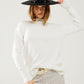 Q2 Loose white sweater with open back detail