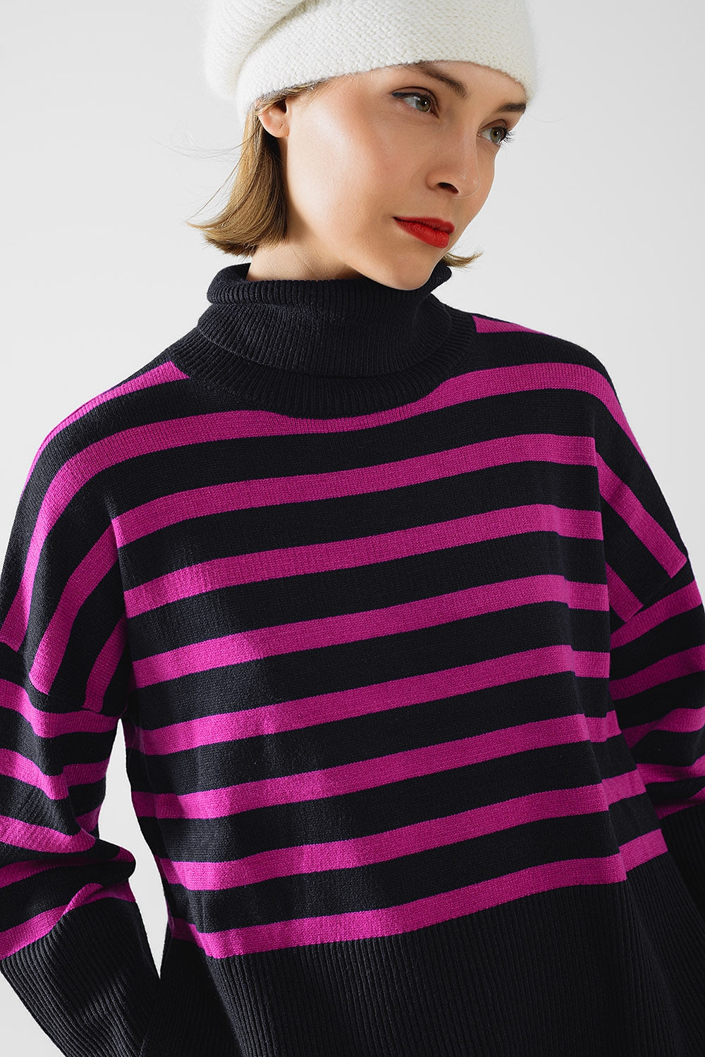 Q2 Navy oversized trutleneck sweater with fuchsia stripes and splits on the side