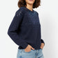 Navy soft knit sweater embellished with sequins on the front
