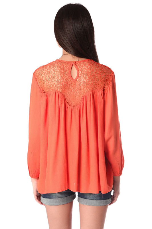 Orange smock blouse with cage detail