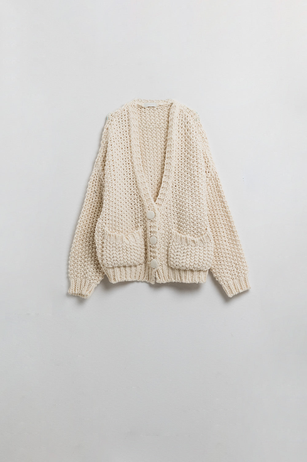 Oversized beige chunky knit jacket with pockets