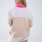 Oversized beige sweater with brown stripes and V-neck