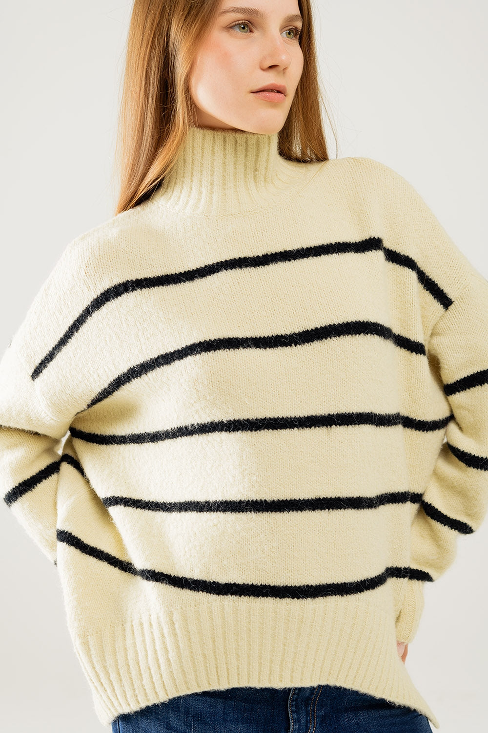 Oversized cream sweater with black stripes