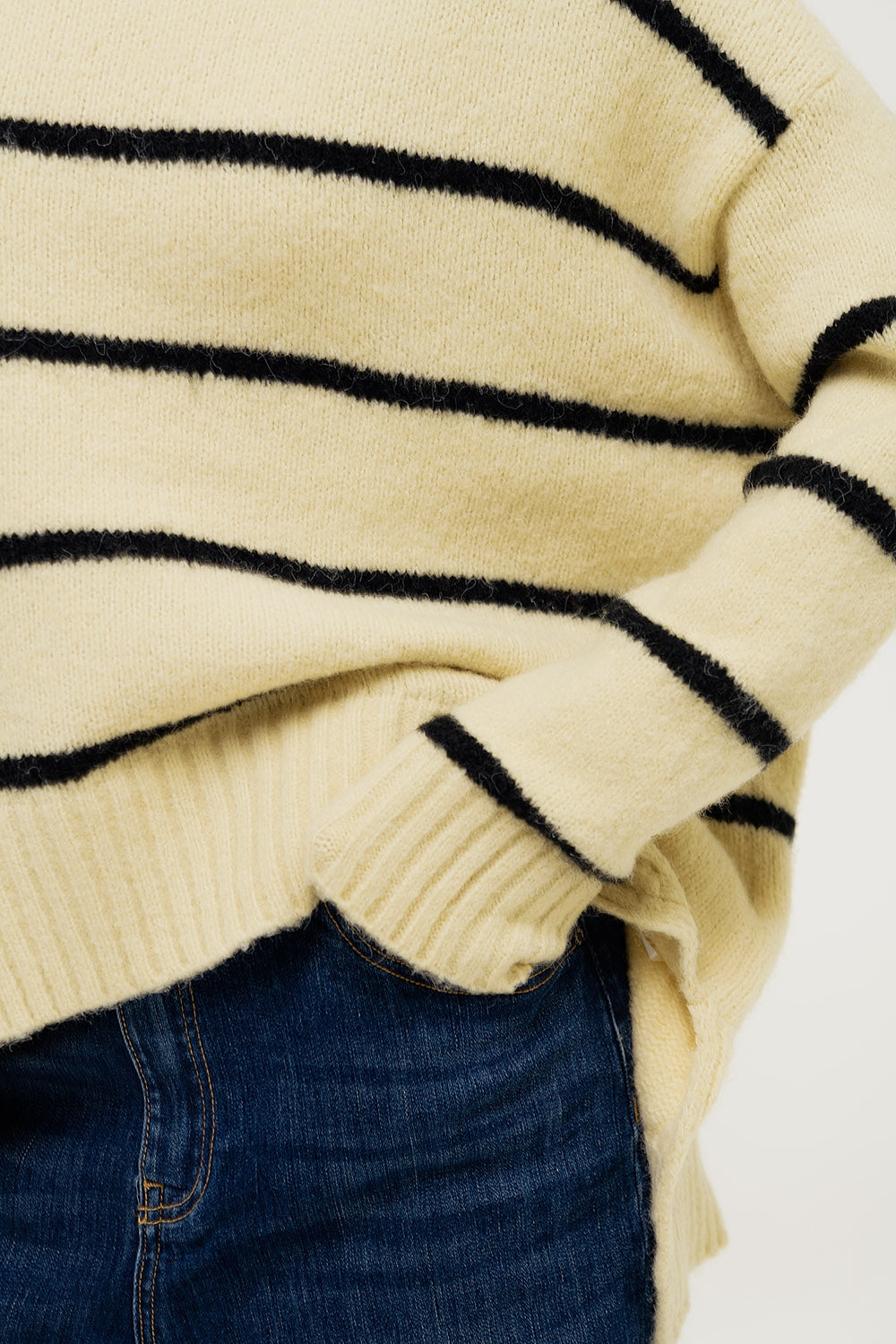 Oversized cream sweater with black stripes