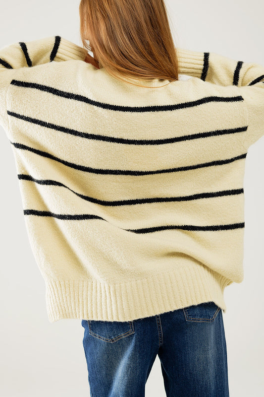 Oversized cream sweater with black stripes