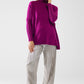 oversized soft fuchsia sweater with ribbed sleeves