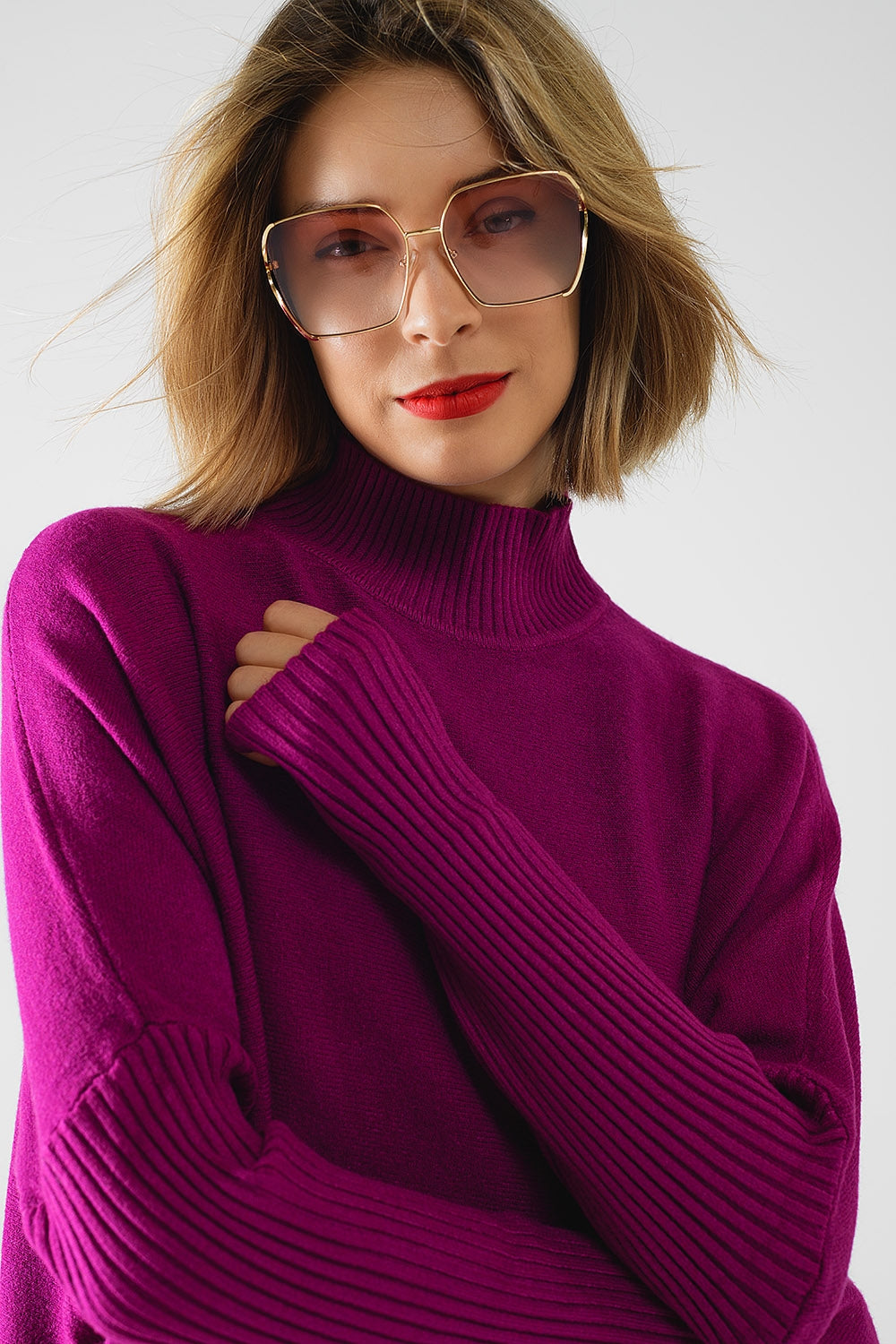 oversized soft fuchsia sweater with ribbed sleeves