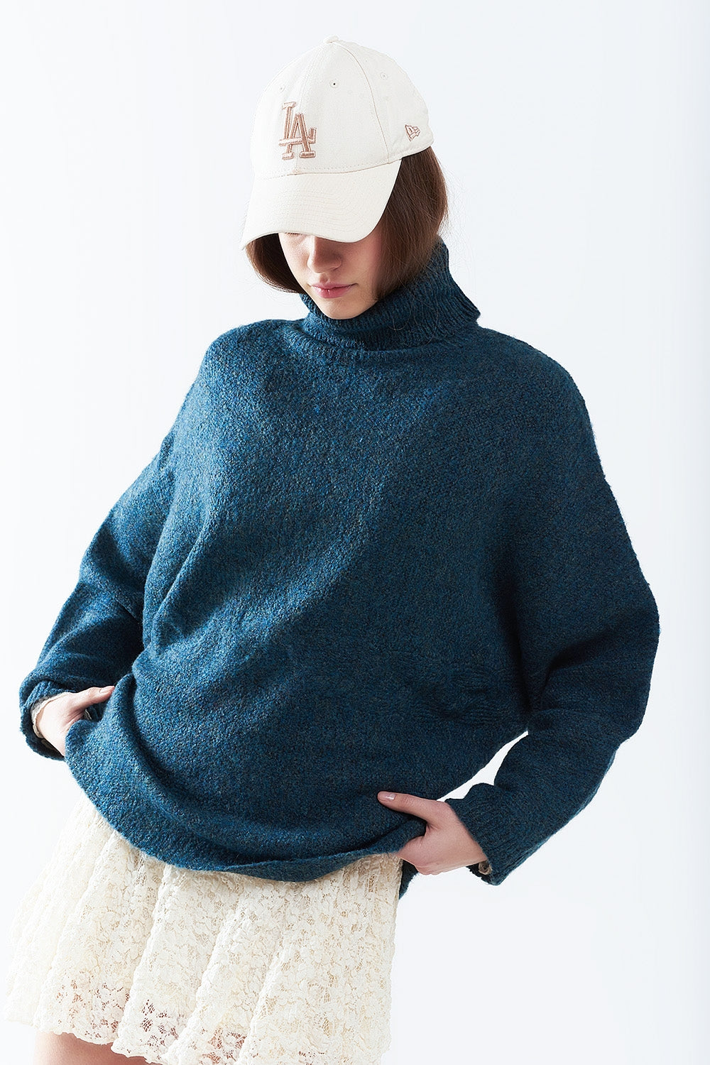 Q2 Oversized sweater in teal with a high neck and loose sleeves