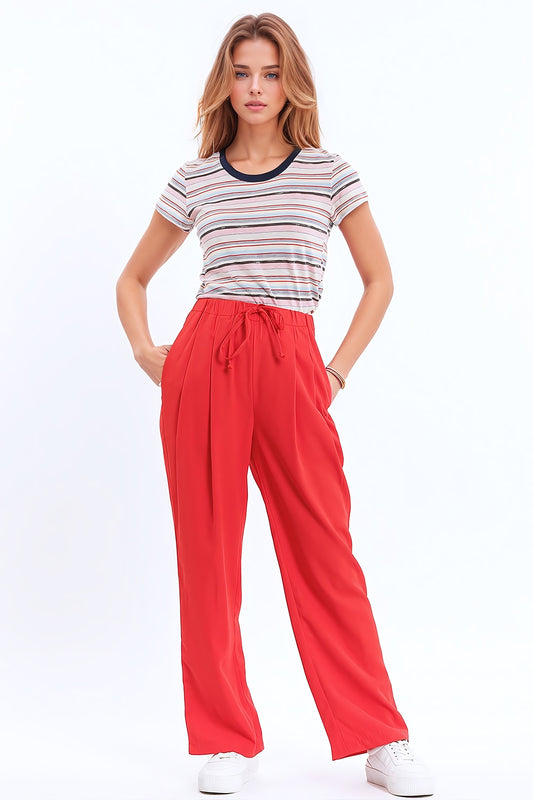 Q2 Pants In Coral With Front Pockets And Drawstring Closing