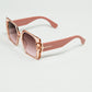 Pink square sunglasses with gold detail on the side