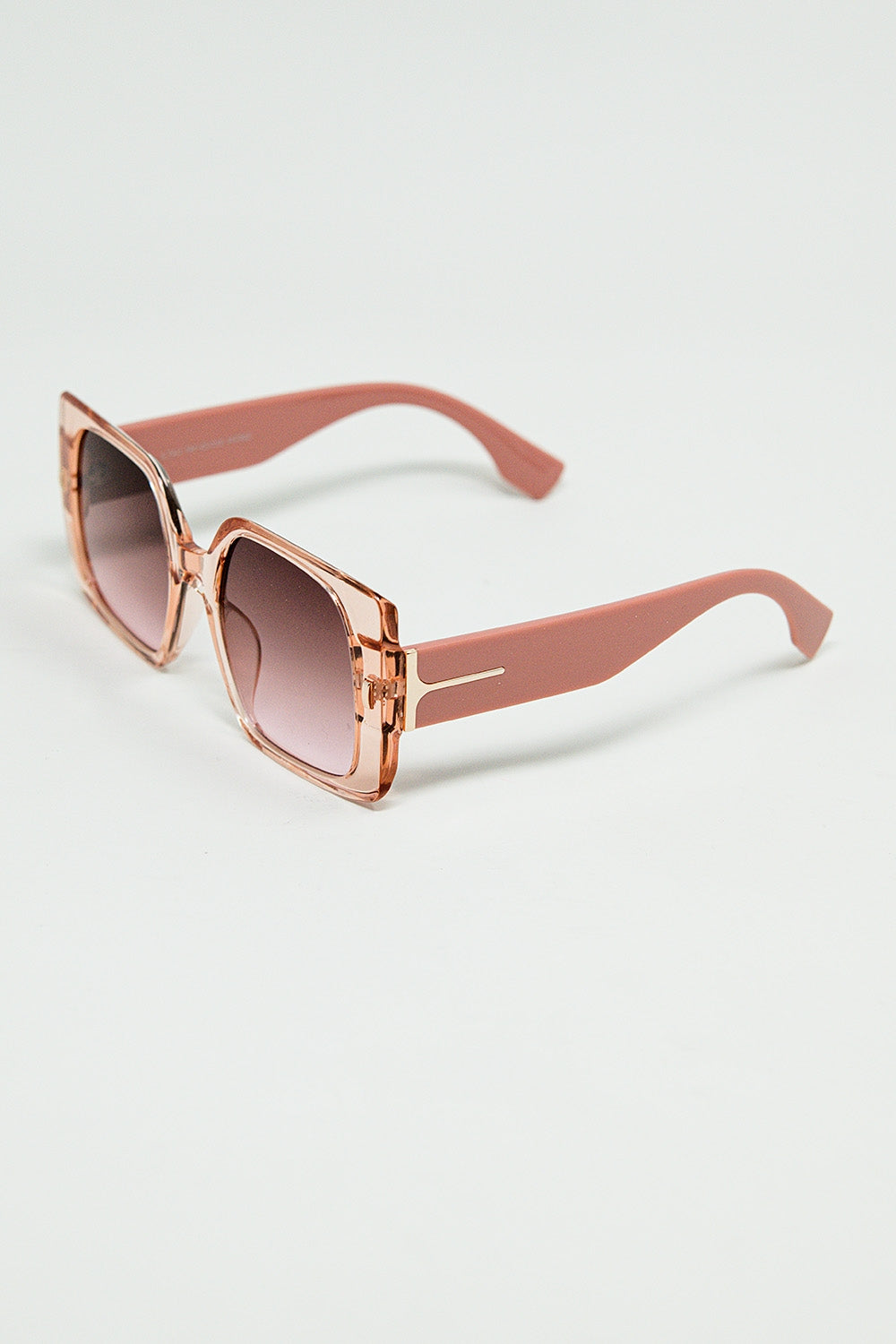 Pink square sunglasses with gold detail on the side