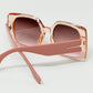 Pink square sunglasses with gold detail on the side