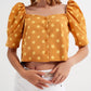 Polka dot top with puffed sleeves and square neckline in yellow