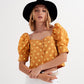 Polka dot top with puffed sleeves and square neckline in yellow