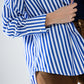 Poplin shirt with vertical stripes in blue and chest pocket