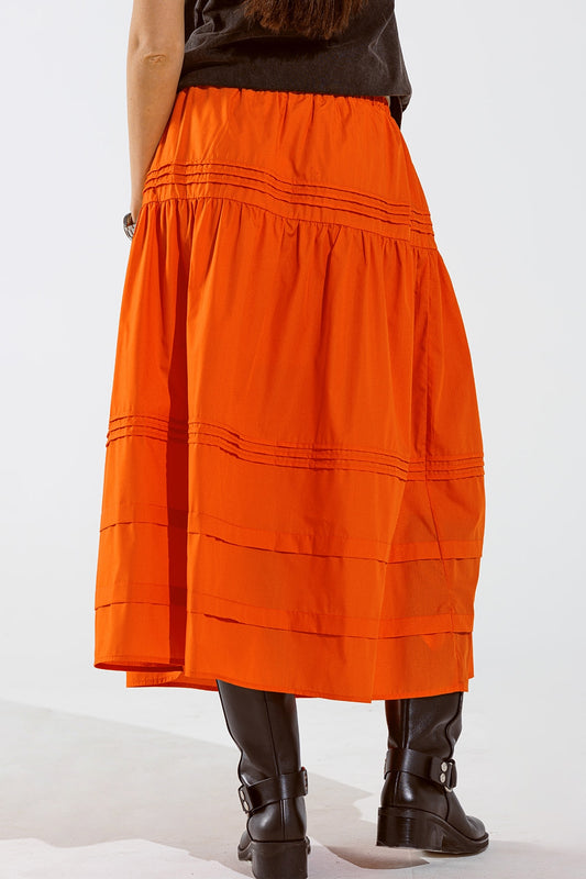 Falda larga de popelina escalonada con detalles de costuras en naranja