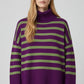 Purple oversized turtleneck sweater with green stripes and splits on the side