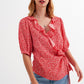 Red wrap top in clustered flower print