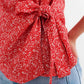 Red wrap top in clustered flower print