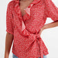 Red wrap top in clustered flower print