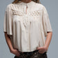 Q2 Relaxed Beige boho-style blouse with embroidered details