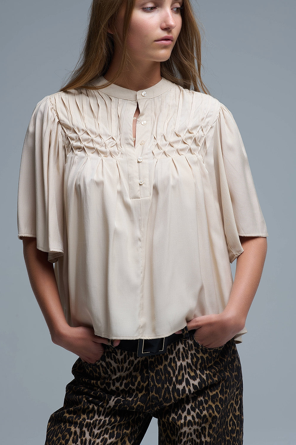 Q2 Relaxed Beige boho-style blouse with embroidered details