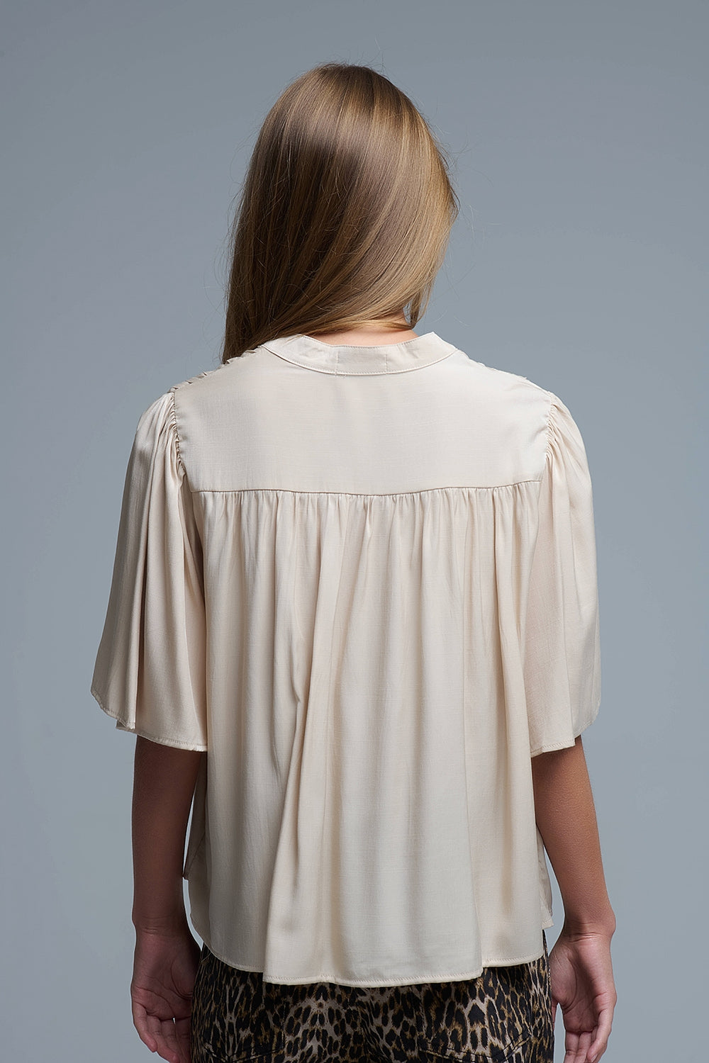 Relaxed Beige boho-style blouse with embroidered details