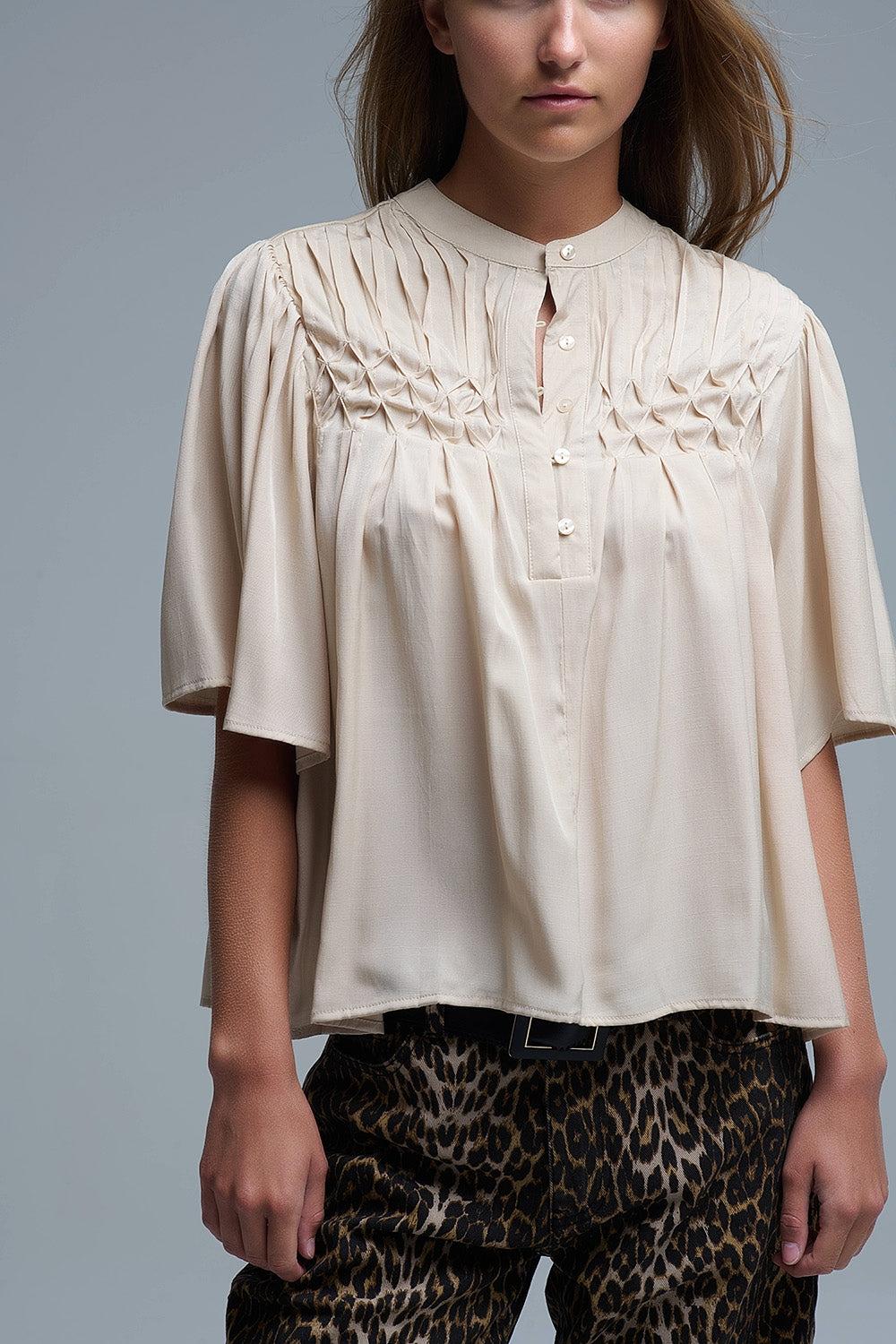 Relaxed Beige boho-style blouse with embroidered details