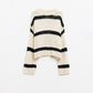 Relaxed beige jumper with black stripes