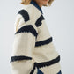 Relaxed beige jumper with black stripes