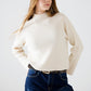 relaxed cream ribbed high neck sweater