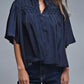 Q2 Relaxed Navy boho-style blouse with embroidered details