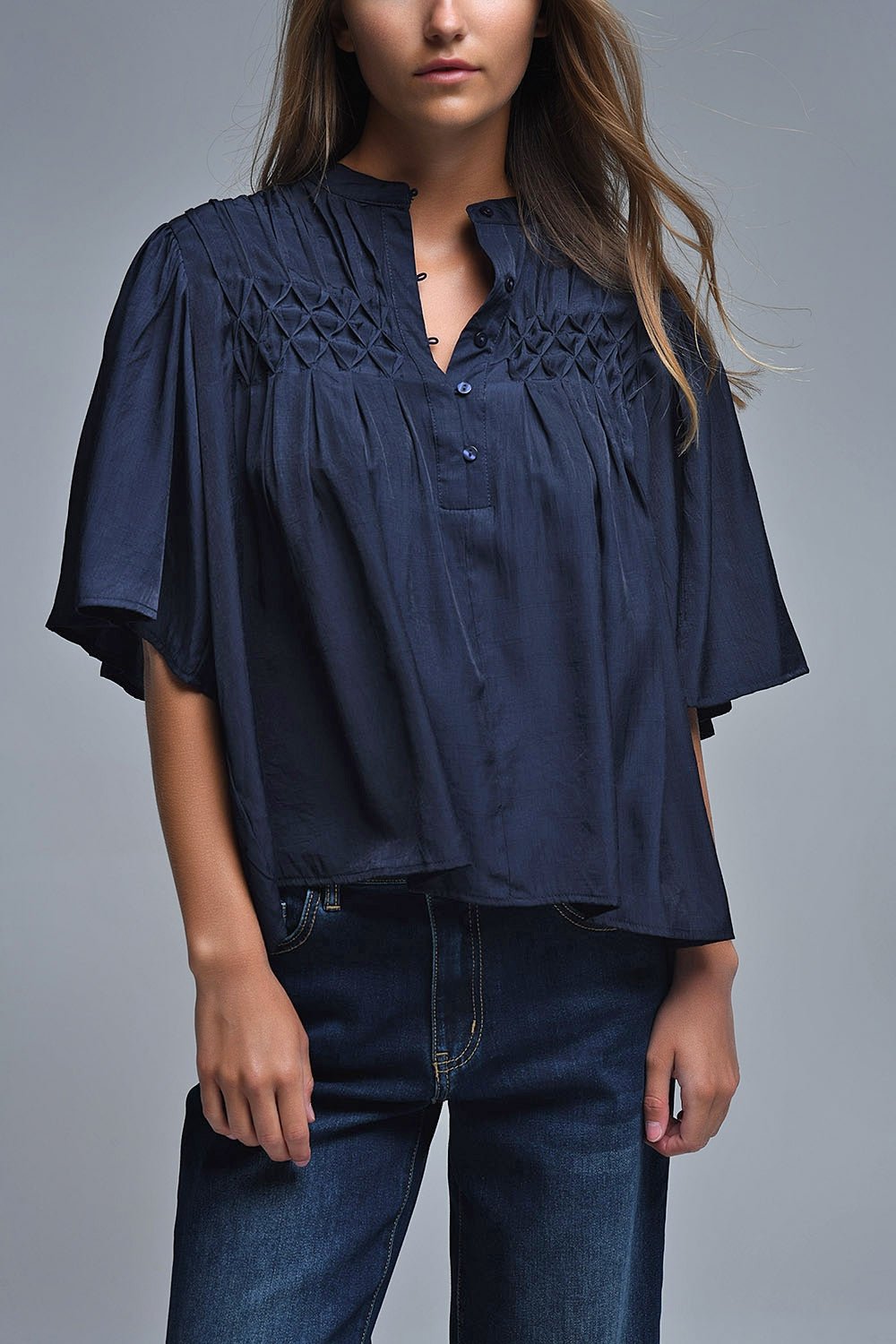Q2 Relaxed Navy boho-style blouse with embroidered details