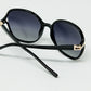 Round sunglasses in black with gold metal detail