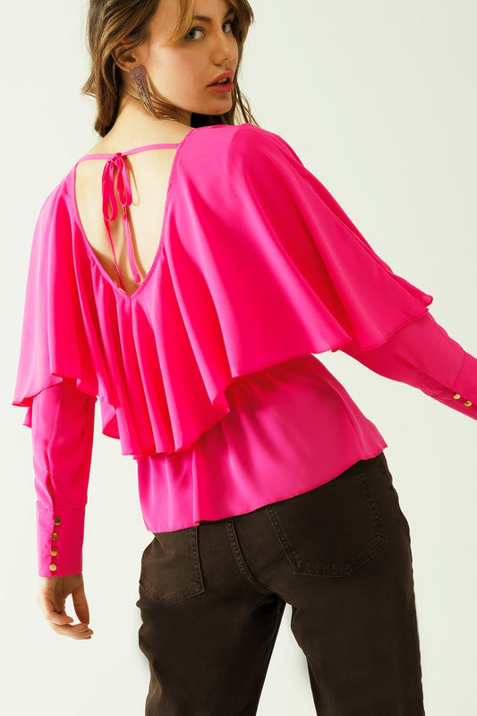 Ruffled V-neck top with buttoned cuffs and tie in the back detal in fuchsia