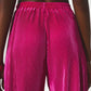 Satin pleated wide leg pants in fuchsia