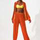 Satin pleated wide leg pants in orange