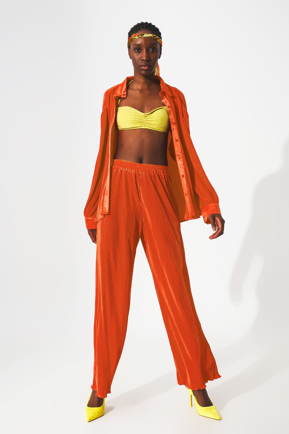 Satin pleated wide leg pants in orange