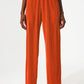 Satin pleated wide leg pants in orange