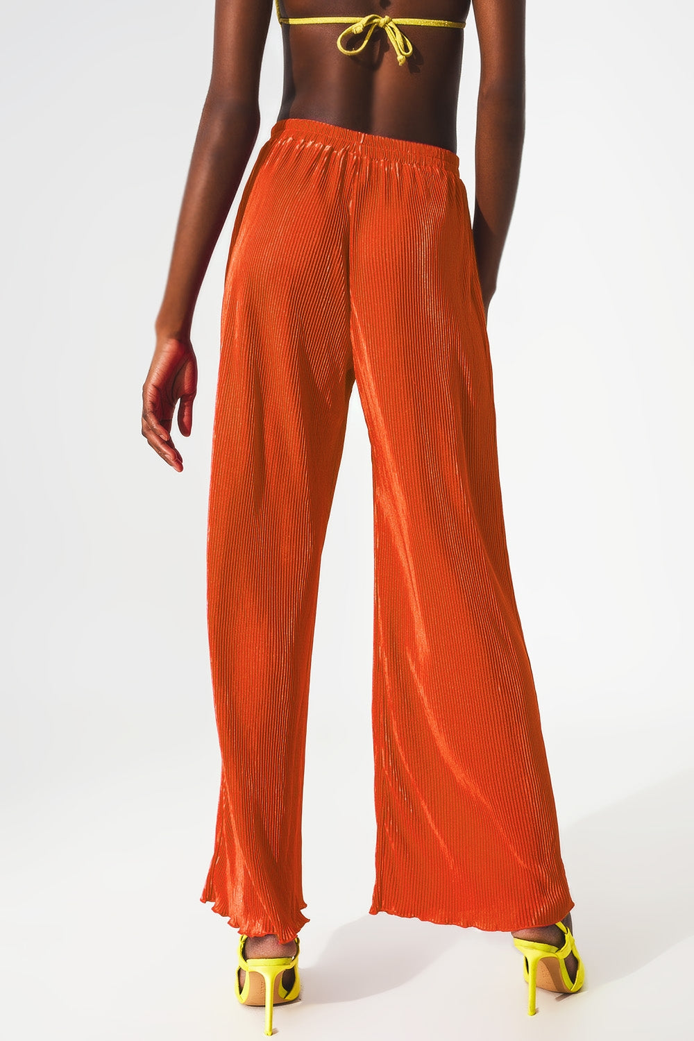 Satin pleated wide leg pants in orange