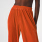 Satin pleated wide leg pants in orange